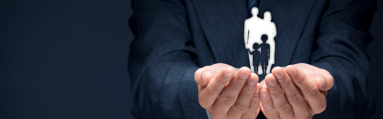 benefits of a family office Business professional reviewing documents with a team in the background, highlighting the strategic benefits of a family office for wealth planning and governance.