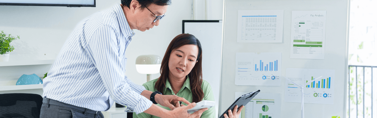 inance-month-end-closing-process Team collaborating on financial reports during the finance month-end closing process in a modern office setting